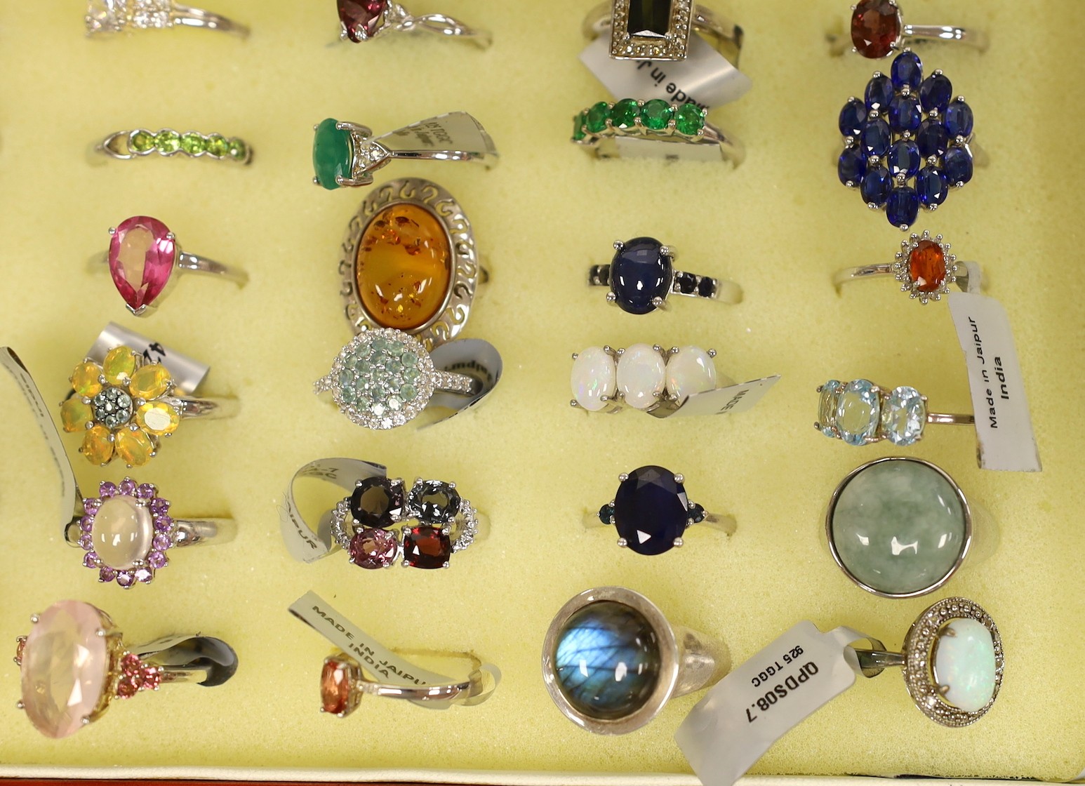 Forty seven assorted modern 925 and gem set rings and seven assorted modern 9ct gold and gem set rings, in ring box (hinges damaged).
